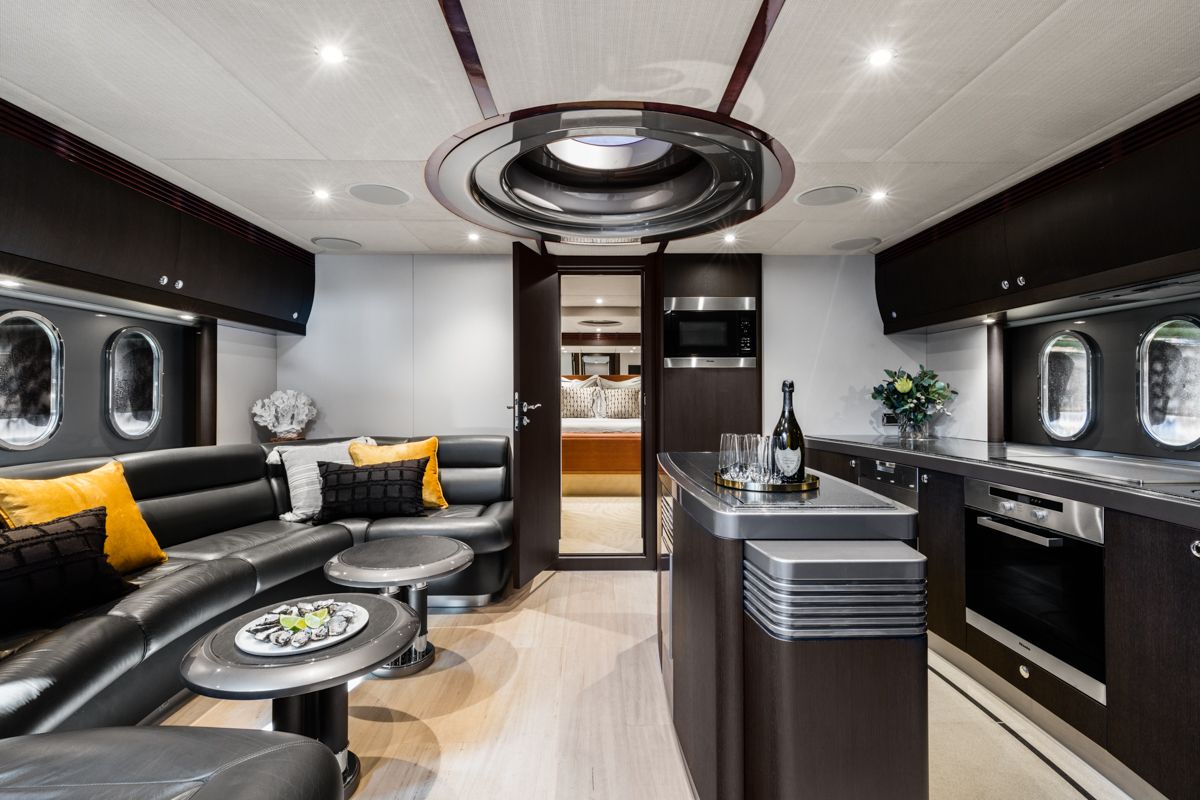 PRIVACY's saloon with leather lounge and galley