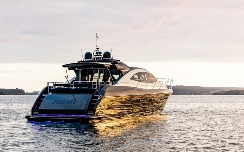 PRIVACY at anchor with a golden sunset reflection